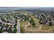 Aerial view of a community with walking paths and green spaces at 32 Whitehaven Cir, Highlands Ranch, CO 80129