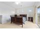Primary bedroom with carpeted floors, a ceiling fan, and a sliding door at 32 Whitehaven Cir, Highlands Ranch, CO 80129