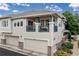 Attractive two-story home showcasing a charming balcony, spacious garage, and manicured landscaping at 32 Whitehaven Cir, Highlands Ranch, CO 80129