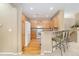 Kitchen view from sitting area with breakfast bar and kitchen appliances at 32 Whitehaven Cir, Highlands Ranch, CO 80129