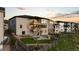 This backyard features a fire pit, green turf, and an open patio deck at 7611 Copper Sky Ct, Castle Pines, CO 80108