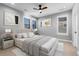 This bedroom features neutral decor, a ceiling fan, and lots of natural light at 7611 Copper Sky Ct, Castle Pines, CO 80108