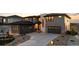 This home features stone accents, modern design, and an attached garage at 7611 Copper Sky Ct, Castle Pines, CO 80108