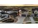 This home features an attached garage and a driveway lined with decorative rocks at 7611 Copper Sky Ct, Castle Pines, CO 80108