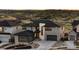Beautifully landscaped two-story home boasts modern architecture and mountain views at 7611 Copper Sky Ct, Castle Pines, CO 80108