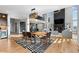 Open-concept living area with a dining room, a living room, and lots of natural light at 7611 Copper Sky Ct, Castle Pines, CO 80108