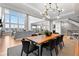 Spacious open-concept living area with dining room and living room, lots of natural light at 7611 Copper Sky Ct, Castle Pines, CO 80108