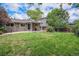 Grassy backyard provides a great space for outdoor activities and relaxation with a deck for entertaining at 1962 S Ivory Way, Aurora, CO 80013