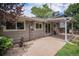 Spacious backyard patio features a covered area and sliding glass doors for easy indoor-outdoor living at 1962 S Ivory Way, Aurora, CO 80013