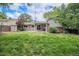 Lush backyard features a patio, shed for storage, and mature trees, offering a private outdoor space at 1962 S Ivory Way, Aurora, CO 80013