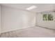Bright bedroom with natural light, neutral carpet, and a skylight at 1962 S Ivory Way, Aurora, CO 80013