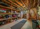 Unfinished basement provides room for storage with wooden shelving at 31412 N Bermuda Dunes Dr, Evergreen, CO 80439