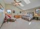 Bright bedroom with vaulted ceiling, skylights, and comfortable furnishings at 31412 N Bermuda Dunes Dr, Evergreen, CO 80439