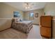 This bedroom features a bed with colorful patterned bedding and a ceiling fan at 31412 N Bermuda Dunes Dr, Evergreen, CO 80439