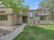 Charming home featuring a lush green lawn and inviting front door at 31412 N Bermuda Dunes Dr, Evergreen, CO 80439