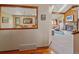 View through a home's archway to a living space with a fireplace at 31412 N Bermuda Dunes Dr, Evergreen, CO 80439