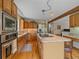 Modern kitchen with an island cooktop, stainless steel appliances and hardwood floors at 31412 N Bermuda Dunes Dr, Evergreen, CO 80439