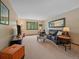 Spacious living room with comfortable seating, a large window, and neutral tones at 31412 N Bermuda Dunes Dr, Evergreen, CO 80439