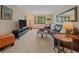 Comfortable living room with leather sofa, natural light from large window, and contemporary decor at 31412 N Bermuda Dunes Dr, Evergreen, CO 80439