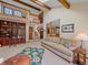 Bright and airy living space with a vaulted ceiling, open staircase, and comfortable furnishings at 31412 N Bermuda Dunes Dr, Evergreen, CO 80439