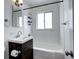 Bathroom with modern fixtures, including a vanity with storage and a shower-tub combination at 361 N Raleigh St, Denver, CO 80219
