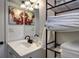 Bathroom featuring modern fixtures, a unique mirror, and storage shelves at 361 N Raleigh St, Denver, CO 80219