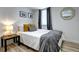 Comfortable bedroom with warm lighting, stylish decor, and pleasant window view at 361 N Raleigh St, Denver, CO 80219
