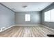 Bright bedroom featuring sleek floors and a corner windows, perfect for relaxation and comfort at 361 N Raleigh St, Denver, CO 80219