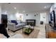 Inviting living room featuring a comfortable couch, modern decor, and sleek flooring at 361 N Raleigh St, Denver, CO 80219