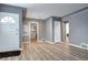 Inviting living room featuring sleek floors and white trim doors, offering a bright and modern aesthetic at 361 N Raleigh St, Denver, CO 80219
