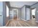 Inviting living room with sleek floors, decorative niches and white trim, providing a modern aesthetic at 361 N Raleigh St, Denver, CO 80219