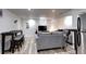 View of the living room showing a comfortable gray couch at 361 N Raleigh St, Denver, CO 80219