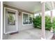 Welcoming front porch with a covered entry, decorative welcome mat, and adjacent window offering natural light at 5400 Perth St, Denver, CO 80249