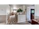 Bright hallway with view into rooms and carpeted flooring at 5400 Perth St, Denver, CO 80249