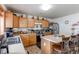 Well-appointed kitchen features stainless appliances, breakfast bar, and ample counter space at 5400 Perth St, Denver, CO 80249