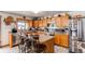 Charming kitchen boasts stainless appliances, breakfast bar, and ample cabinet space at 5400 Perth St, Denver, CO 80249