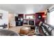 Spacious living room featuring fireplace, plush seating, and natural light at 5400 Perth St, Denver, CO 80249