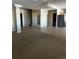 Finished basement with large living space and access to other rooms at 6297 W Prentice Ave, Littleton, CO 80123