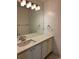 Bathroom with double vanity, quartz countertop and mirror at 6297 W Prentice Ave, Littleton, CO 80123