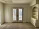Bedroom with French doors opening to a balcony at 6297 W Prentice Ave, Littleton, CO 80123