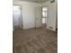 Spacious carpeted bedroom with multiple doors at 6297 W Prentice Ave, Littleton, CO 80123