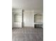Bright bedroom featuring built-in shelving and a workspace at 6297 W Prentice Ave, Littleton, CO 80123