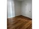 Simple bedroom with hardwood floors and a closet at 6297 W Prentice Ave, Littleton, CO 80123