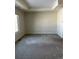Large bedroom with carpeted floors and window at 6297 W Prentice Ave, Littleton, CO 80123