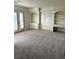 Spacious bedroom with built-in shelving and French doors at 6297 W Prentice Ave, Littleton, CO 80123