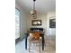 Bright dining area with a wooden table and access to a deck at 6297 W Prentice Ave, Littleton, CO 80123