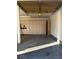 Two-car garage with overhead storage and cabinets at 6297 W Prentice Ave, Littleton, CO 80123