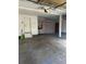 Garage with built-in shelving and extra storage at 6297 W Prentice Ave, Littleton, CO 80123
