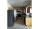 Kitchen with wood cabinets, granite counters, and appliances at 6297 W Prentice Ave, Littleton, CO 80123