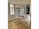 Living area with tiled floors and decorative inlay at 6297 W Prentice Ave, Littleton, CO 80123